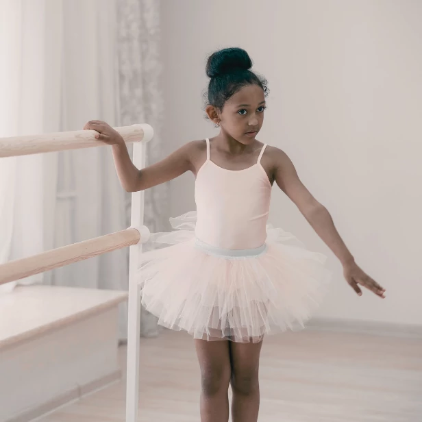 image of ballerina at barre in tutu