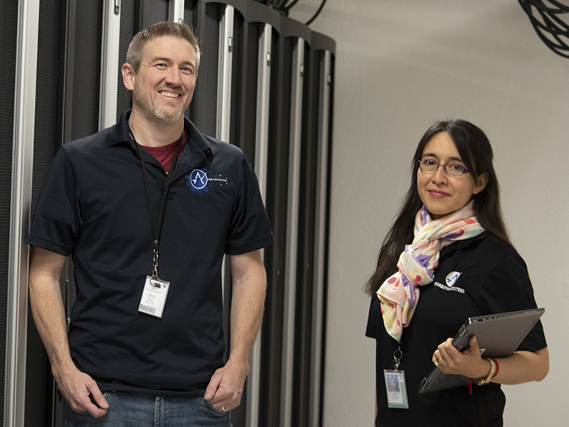 Two smiling Austin-Bergstrom International airport employees