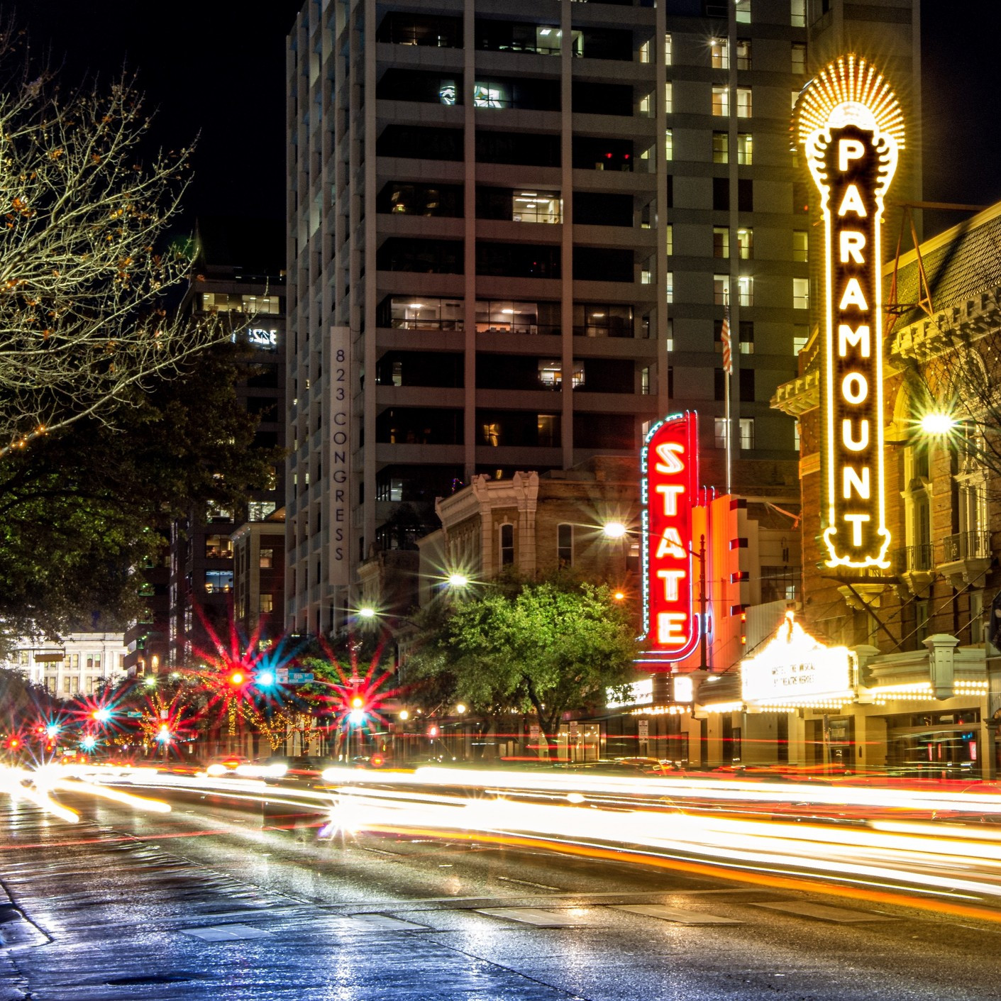 Night shot of the Paramount and State Theaters in downtown Austin