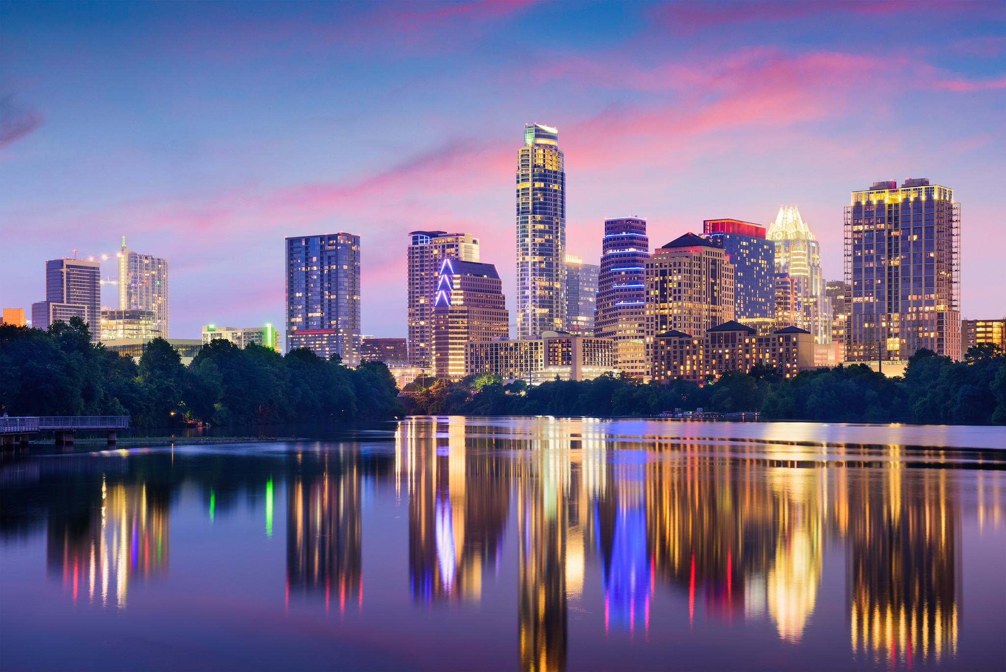 A picture of the Austin, Texas downtown skyline reflecting on the Colorado River at sunset.