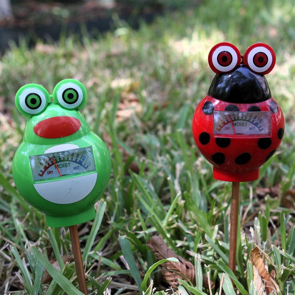 Two lawn moisture meters available from Austin Water, one shaped like a frog and the other a ladybug.