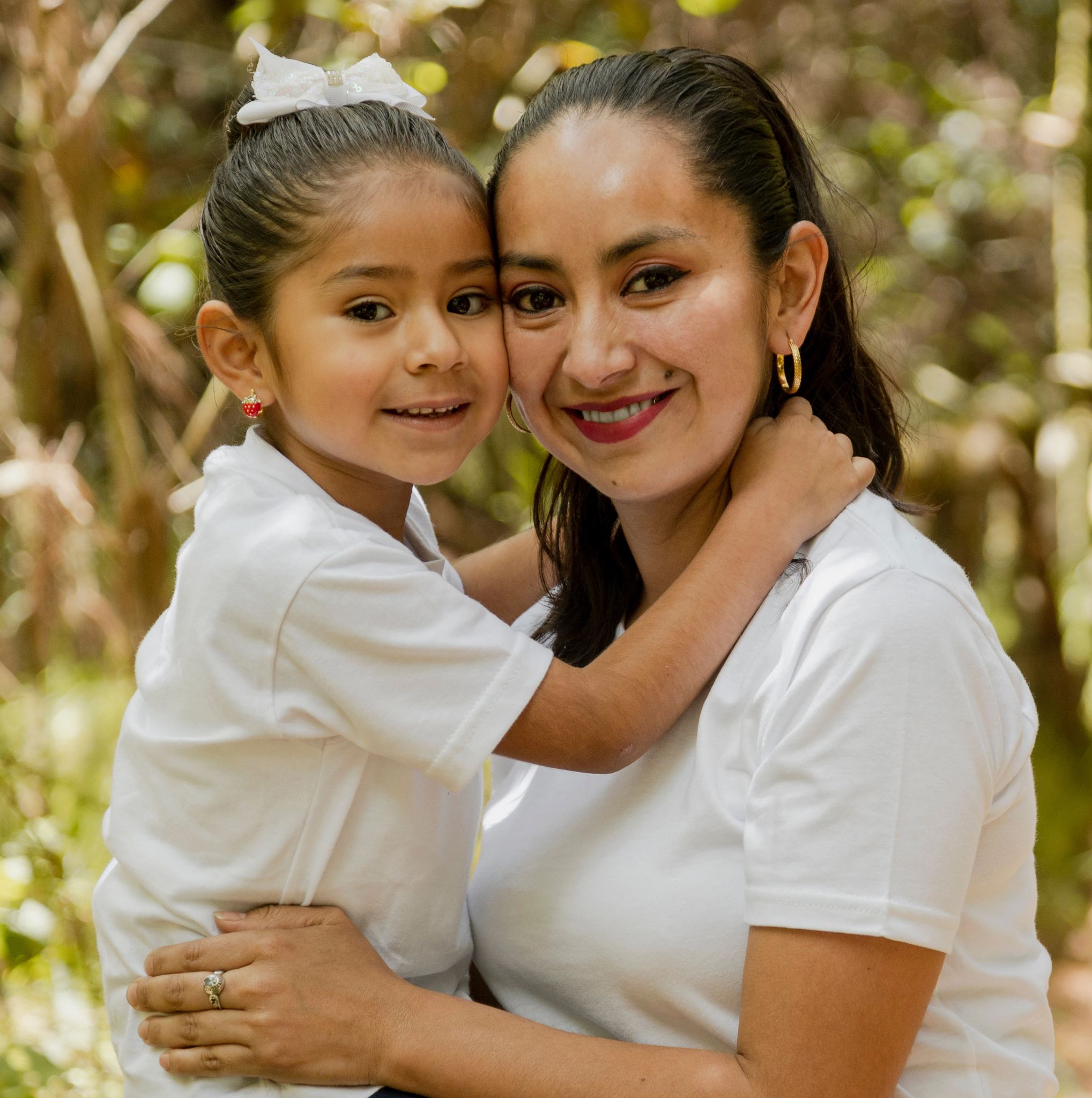 Mother and child embracing.