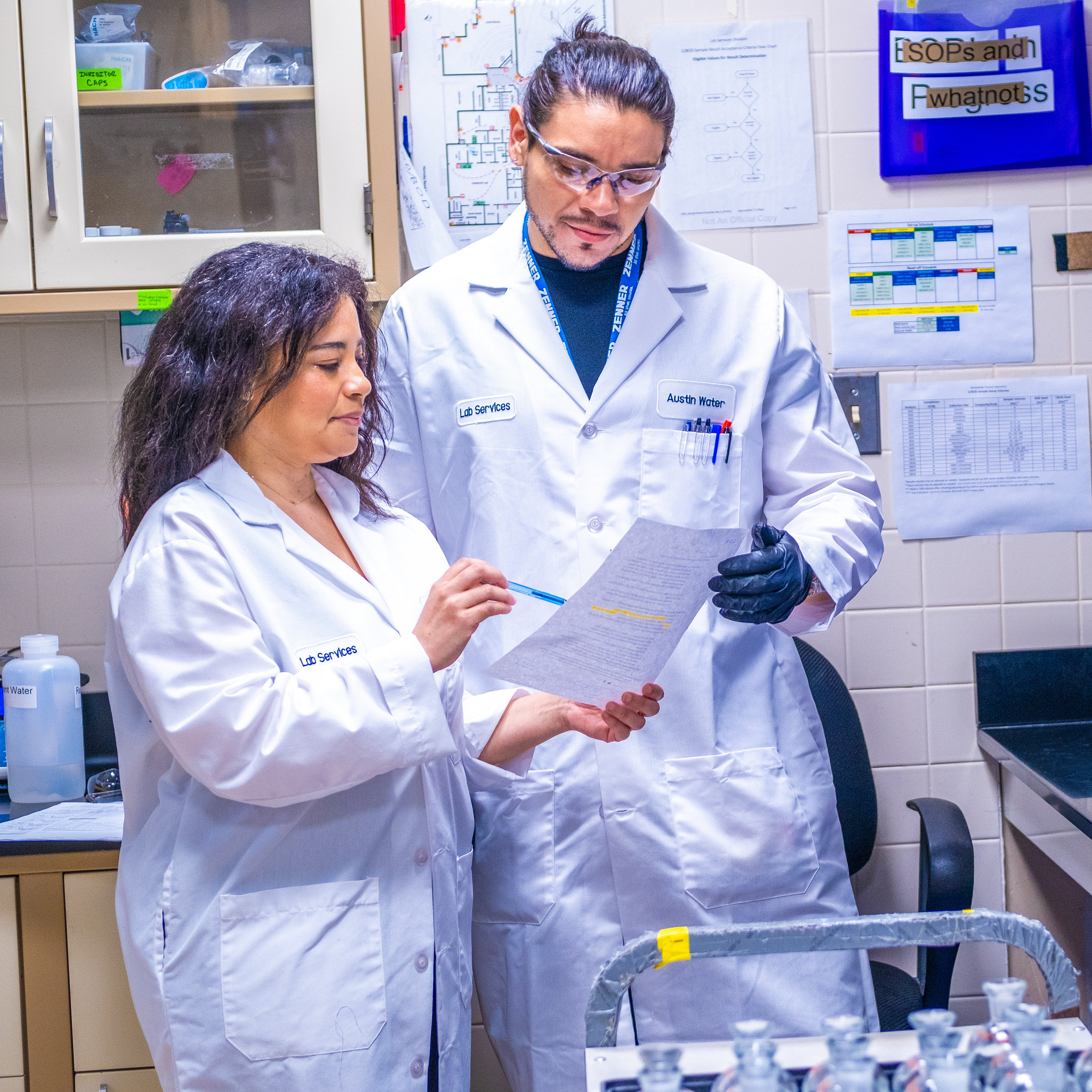 Two Austin Water scientists testing water quality in a lab facility