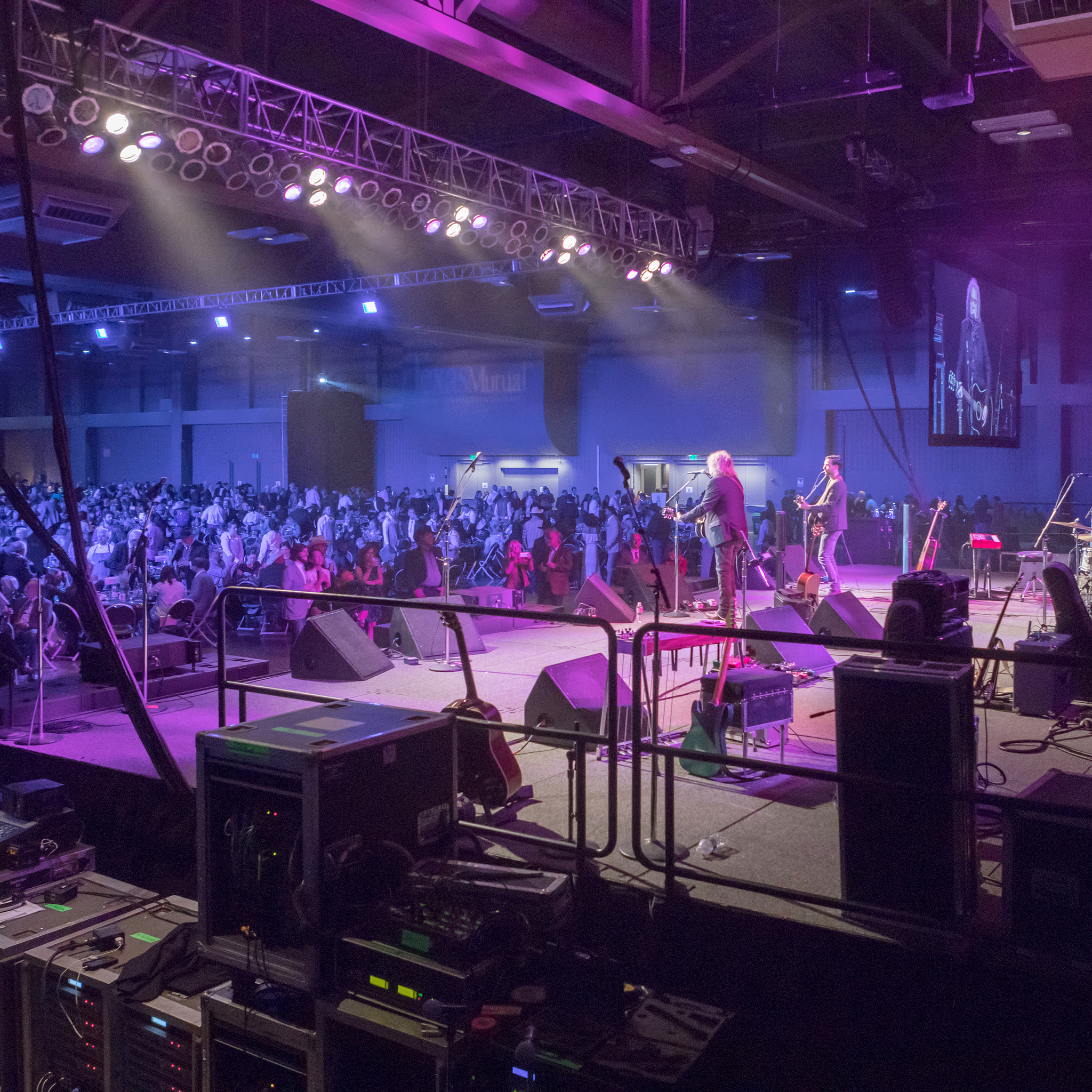 Image of a band playing on stage at the Palmer Events Center showcasing the facility's rigging and audio visual capabilities
