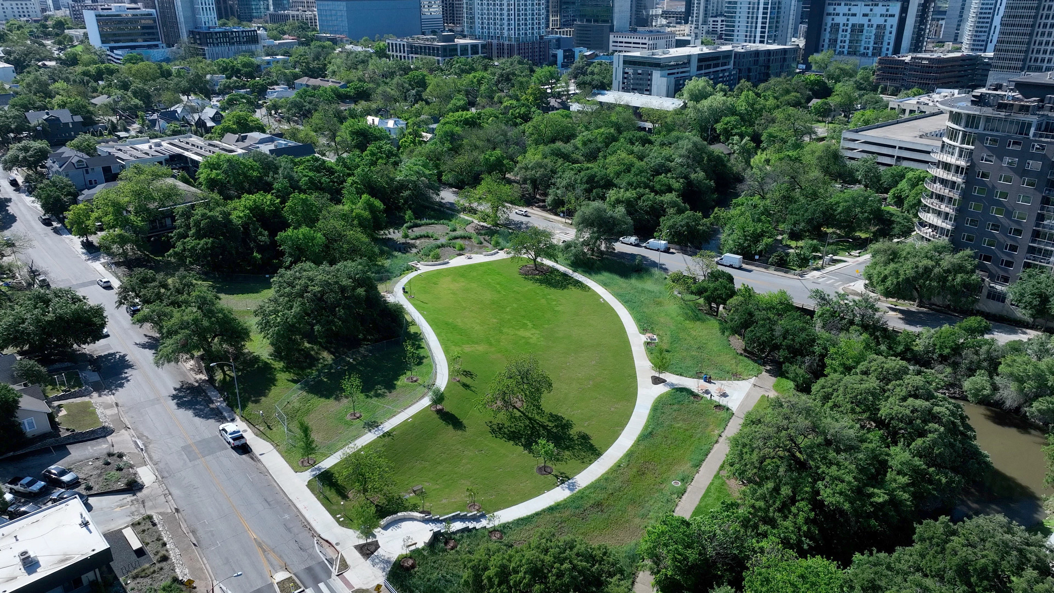 Aerial view of Duncan Neighborhood Park, showcasing it's open green space situated in the middle of downtown