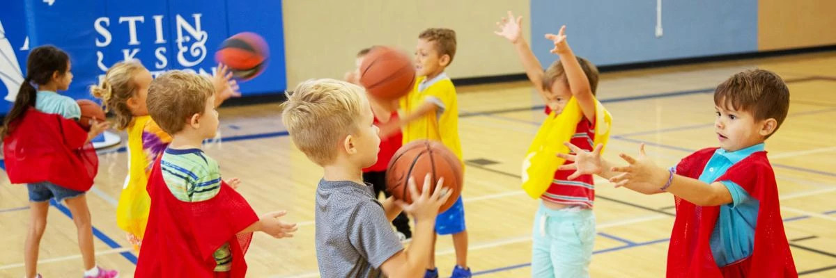Toddlers participating in basketball drills