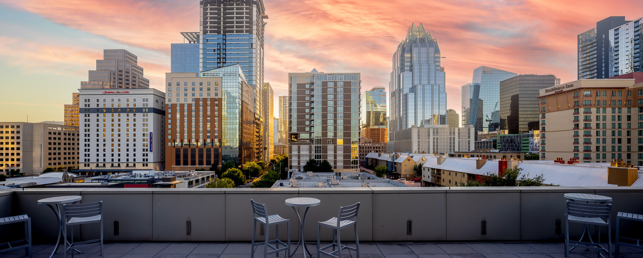 View of hotels in Downtown Austin from the Austin Convention Center terrace at sunset