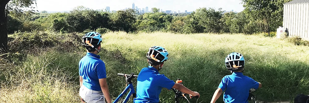 youth getting ready to ride mountain bikes
