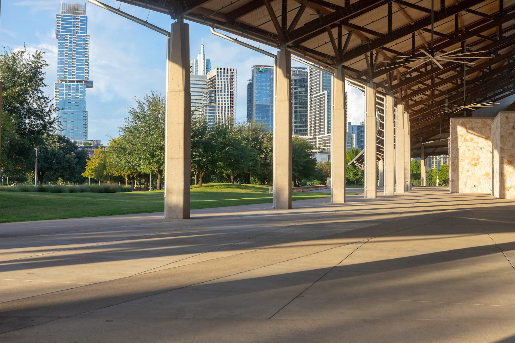 Image of the Palmer Events Center outdoor canopy with the downtown Austin skyline in the background