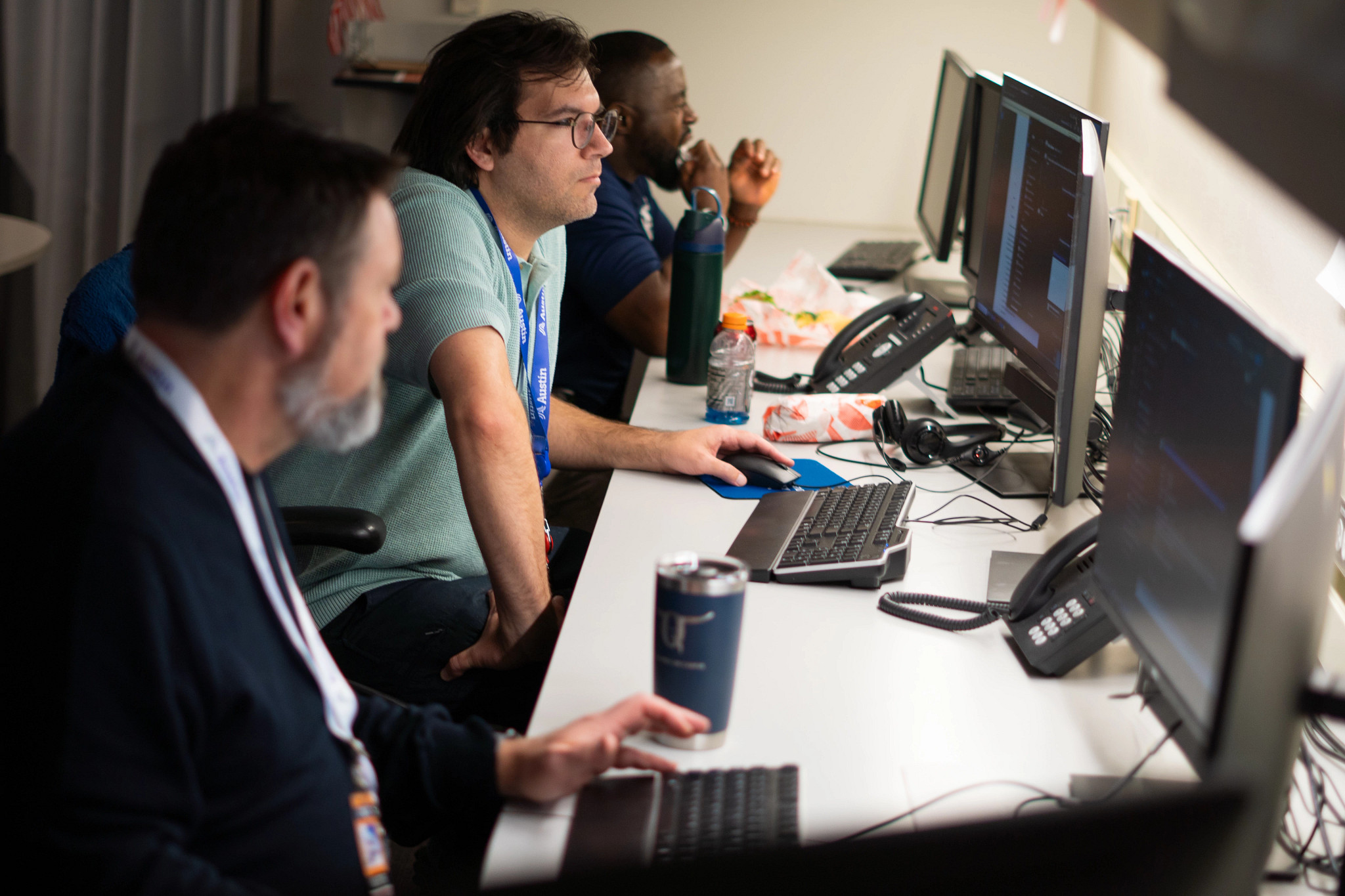 Three City employees working in the emergency operations center