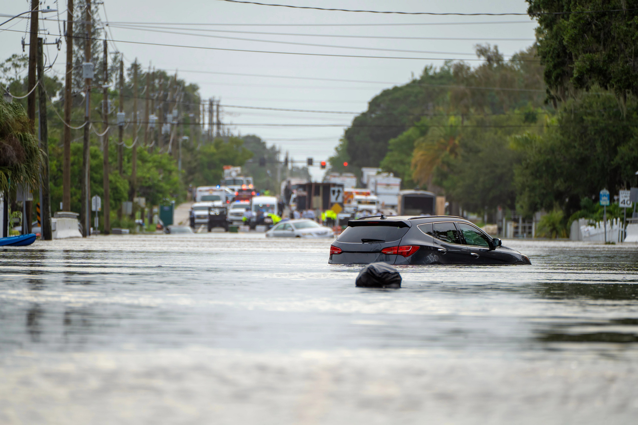 cars in flood zone partially underwater