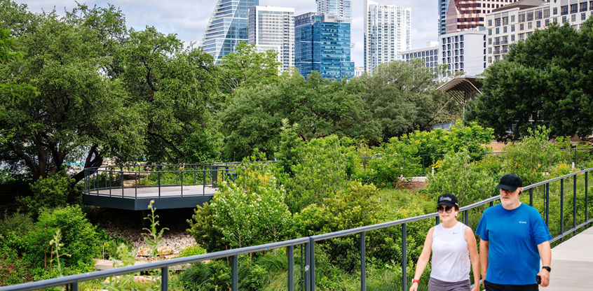 Couple walking on the new path along Waller Creek in Austin, TX.