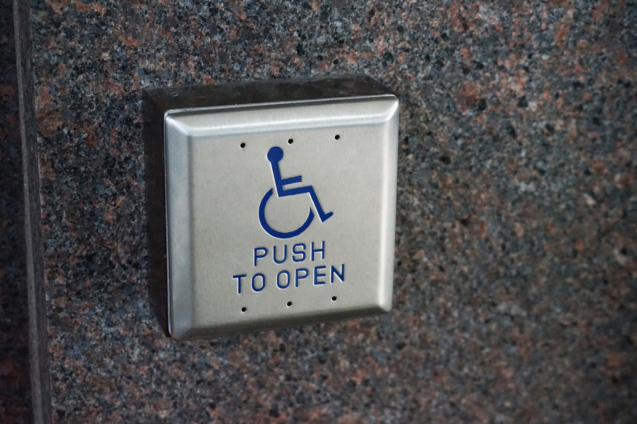 Handicap button at Palmer Events Center that provides door access