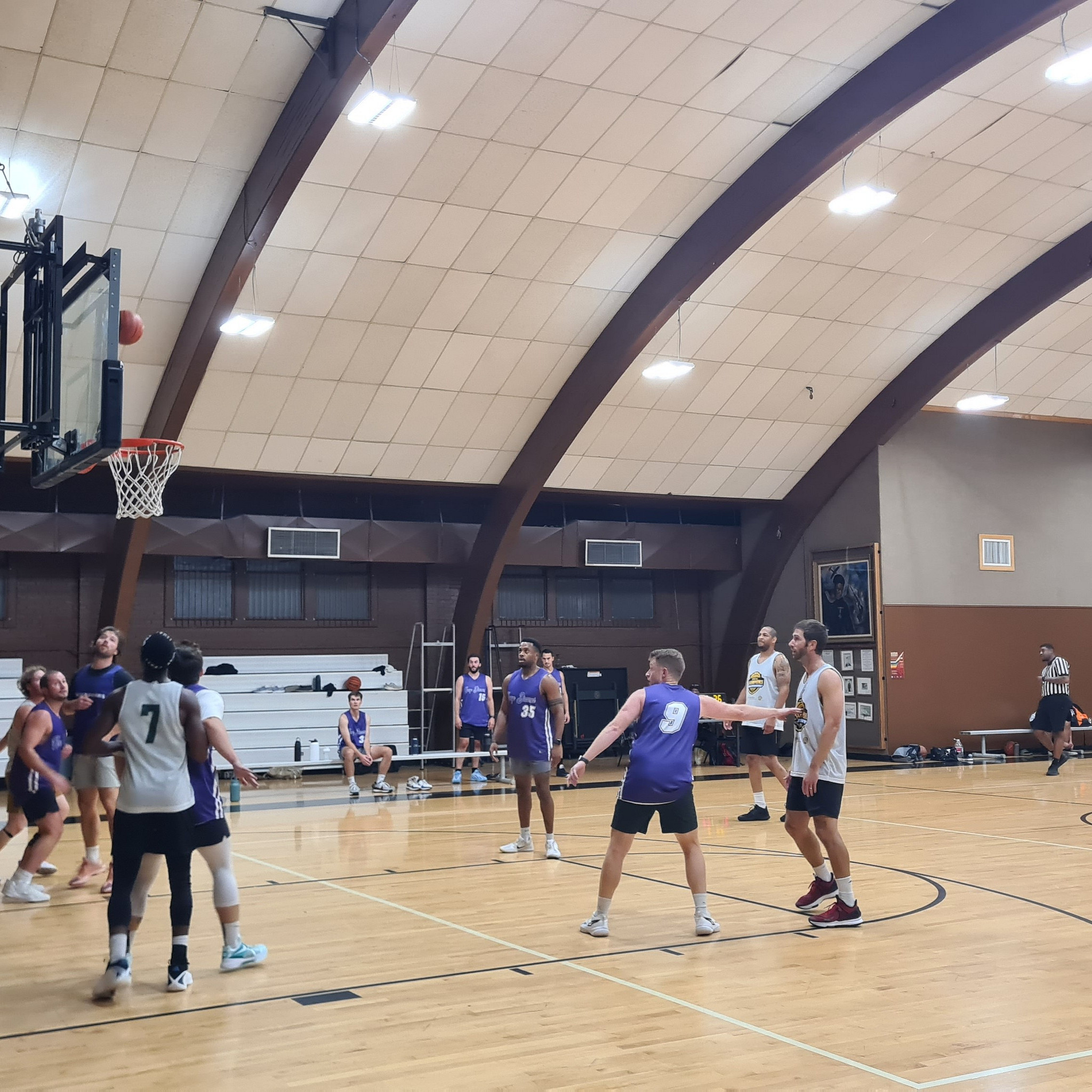 Adult indoor basketball teams playing in the Doris Miller Auditorium gym