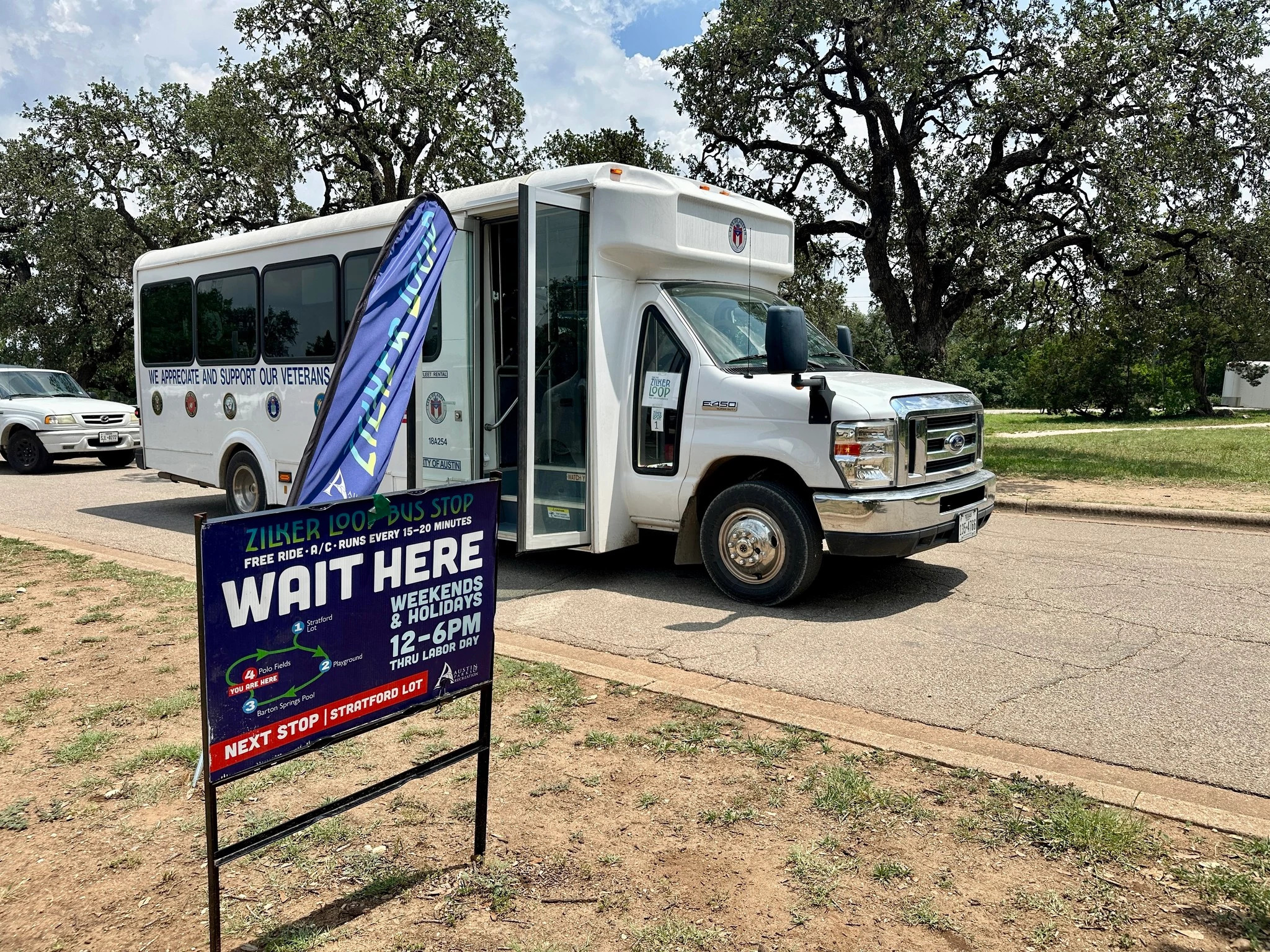 Zilker Loop stop with shuttle ready to pick up passengers to take across Zilker Park