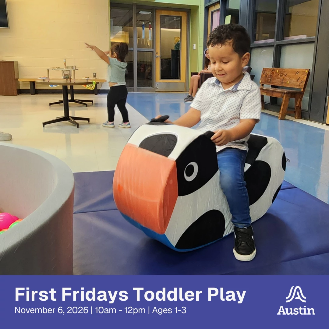 Child playing on cow toy rocker