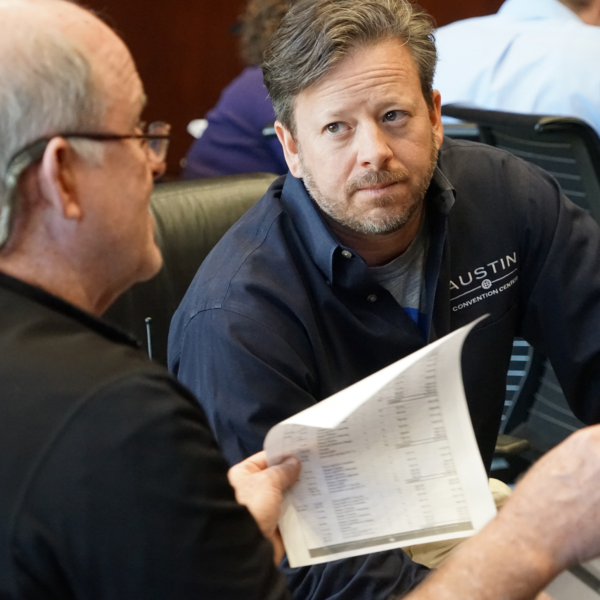 Image of Palmer Events Center staff going over event plans before an event