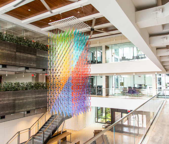 Colorful sculpture hanging from the atrium of the permitting and development center