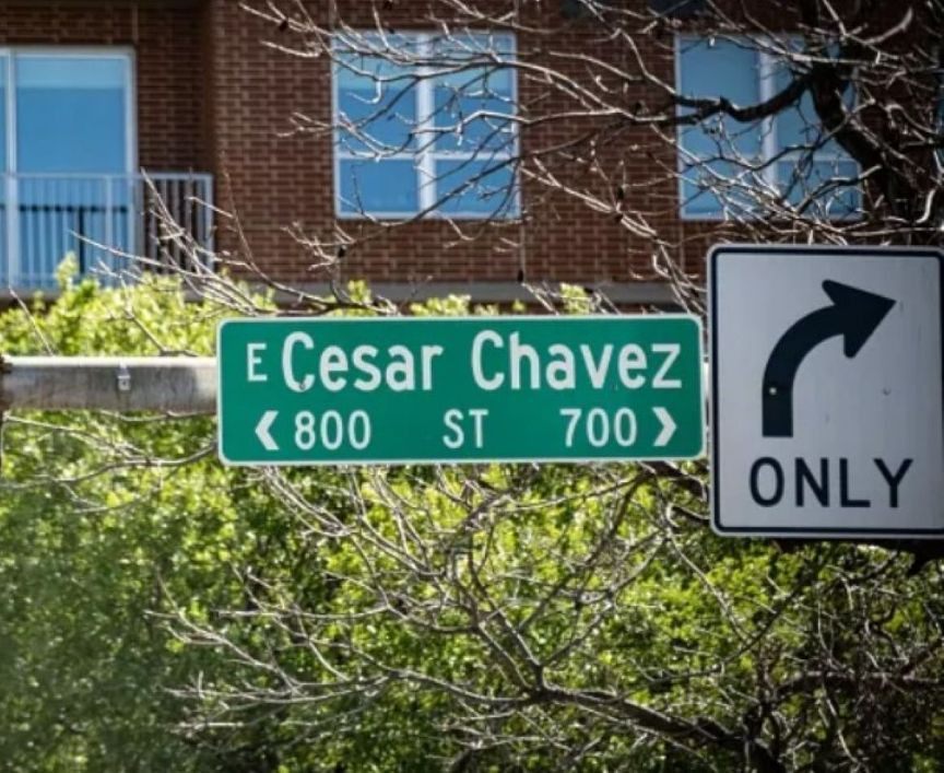 Green street sign for Cesar Chavez Street